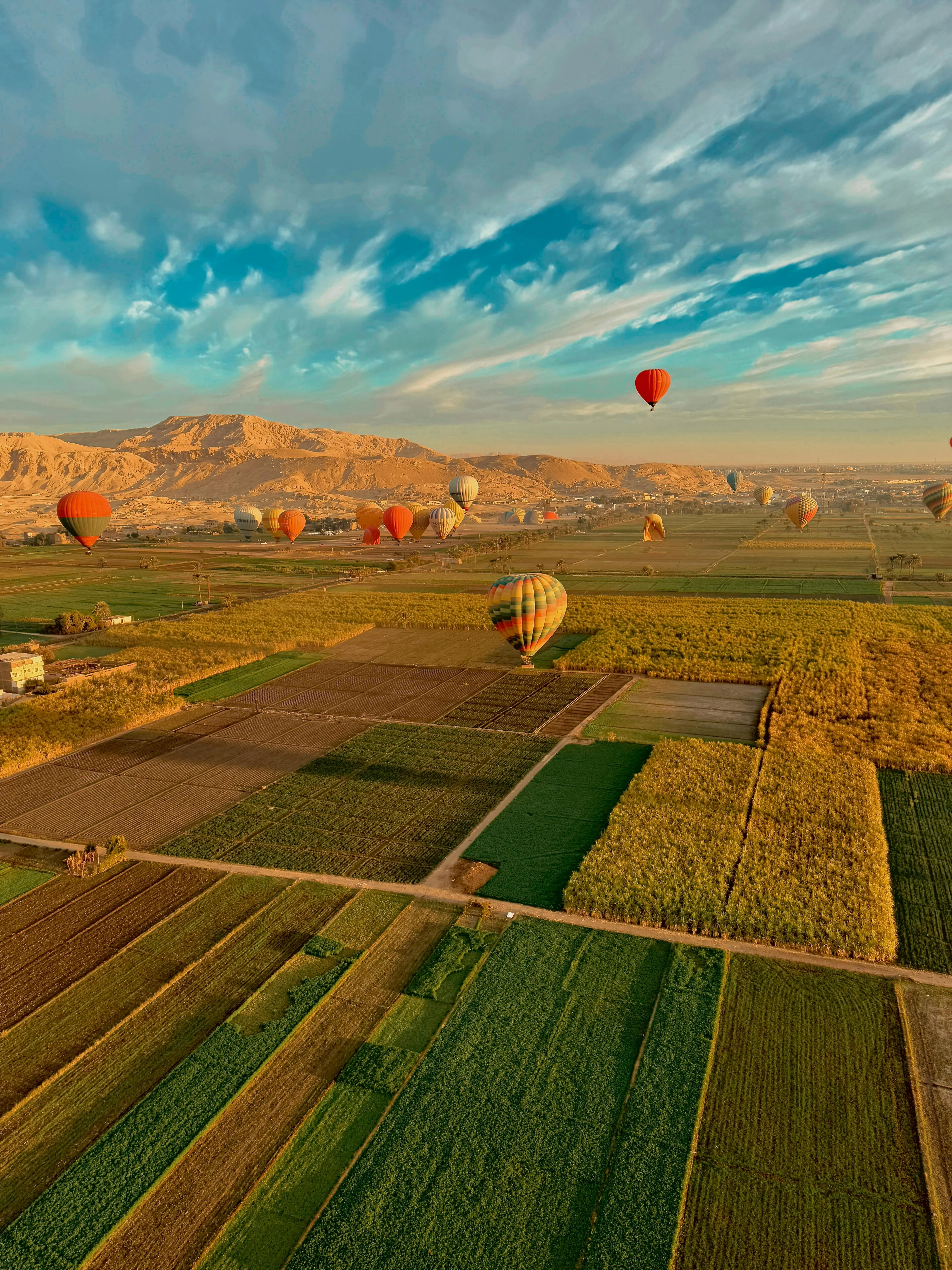 Hot Air Balloon ride flying over the Valley of the Kings in Luxor at sunrise